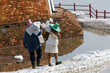 Women carrying sandbags during flood in Thailand Women carrying sandbags during flood in Thailand