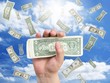 Photo: hand with dollar and falling money hand with dollar and falling money