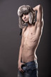 Half-naked gay guy posing in a busby