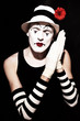 sleep mime in white hat with red flower