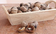 Macro view of walnut on the wood structure Macro view of walnut on the wood structure