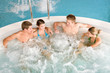 Top view - happy people relax in hot tub