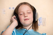 Eight year old girl listening music