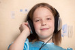 Eight year old girl listening music