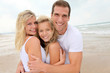 Foto: Portrait of happy family at the beach Portrait of happy family at the beach