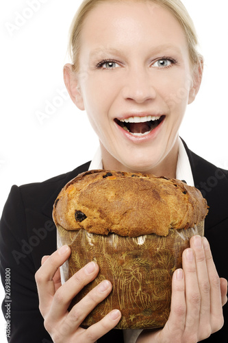 Photo: businesswoman smiling and holding a panettone cake businesswoman smiling and holding a panettone cake