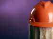 Photo: safety helmet on a purple background safety helmet on a purple background