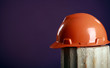 Photo: safety helmet on a purple background safety helmet on a purple background