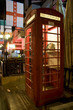 British red street telephone cabine with pub background British red street telephone cabine with pub background