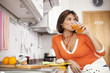 Woman drinking her orange juice