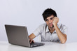 Young working with his laptop