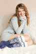 Beautiful girl sitting on the sofa