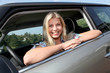 Young woman driving new car Young woman driving new car