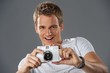 Young man with a camera