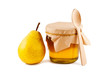 Honey in glass jar, pear, wooden spoon isolated on white backgro
