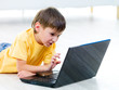 Curious child with laptop