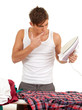 young man ironing clothes, housework