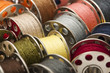Photo: Colorful spools of yarn in a close-up Colorful spools of yarn in a close-up