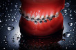 Dentures with braces waterdrops background Dentures with braces waterdrops background