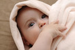 Photo: Beautiful baby wrapped in a pink blanket Beautiful baby wrapped in a pink blanket