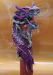 Insence stick inside wooden dragon decoration.