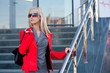 Woman in red jacket standing on the shop Woman in red jacket standing on the shop
