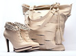 Creamy female boots and leather bag
