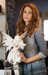 Woman with a white angel in a shop