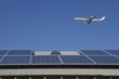 Aeroplane and rooftop with solar array, Inglewood, Los Angeles, California