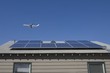 Aeroplane and rooftop with solar array, Inglewood, Los Angeles, California