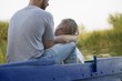 Young couple on blue painted boat, Russia