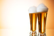 Beer glasses against the colorful gradient background Beer glasses against the colorful gradient background