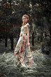 Portrait of romantic woman in fairy forest