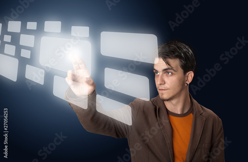 Photo: man pressing a touchscreen button man pressing a touchscreen button