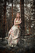 Portrait of romantic woman in fairy forest