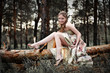 Portrait of romantic woman in fairy forest