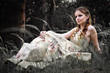 Portrait of romantic woman in fairy forest