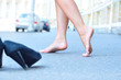 female bare feet dancing on summer street