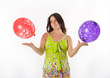 Pregnant woman playing with balloons
