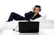 Young nepalese man in pajamas, laptop.