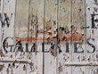 Peeling paint on wooden shutters of old art gallery Peeling paint on wooden shutters of old art gallery