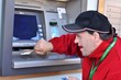 down syndrome man using cash mashine