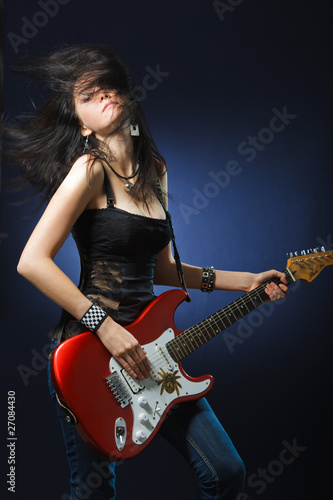 Photo: Beautiful dancing girl with a guitar Beautiful dancing girl with a guitar