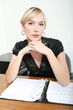 Business Woman in a Office with a notebook