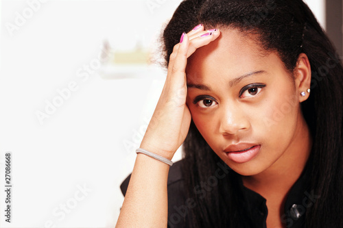 Photo: Young office woman with headache or stress Young office woman with headache or stress