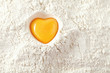 love to bake it!  egg  yolk on flour, full frame