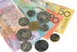 Australian banknotes and coins on plain white background