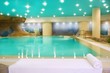 spa indoor turquoise water white towel
