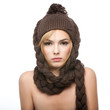 young woman wearing a brown hat