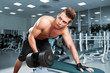 Muscular man working his biceps